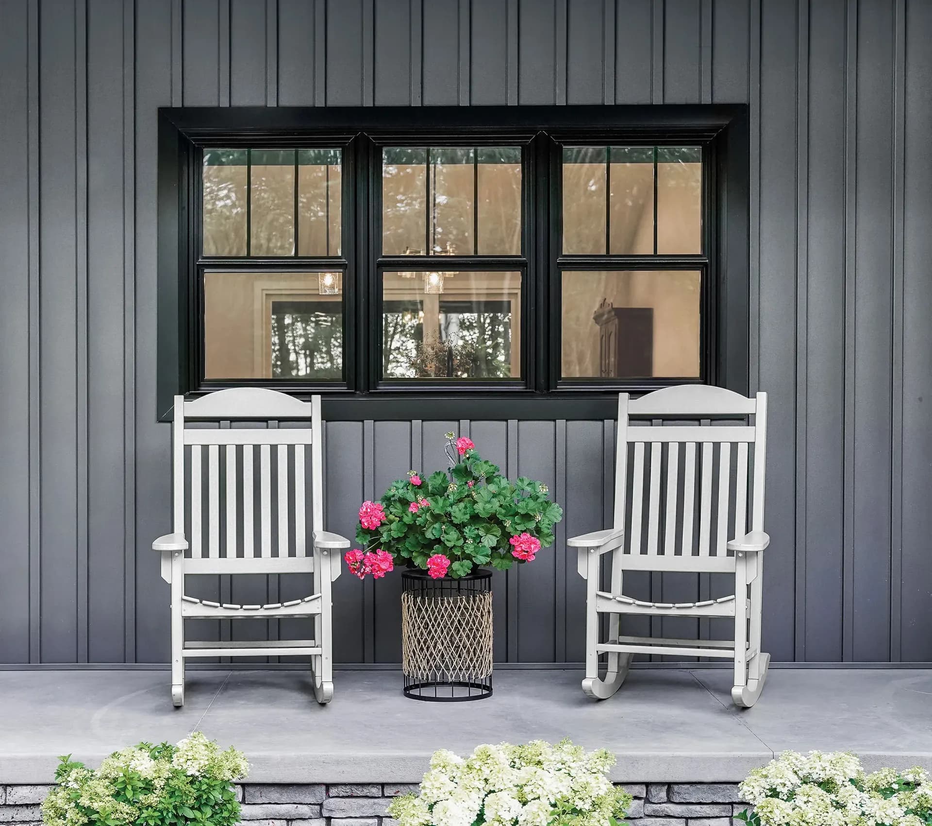 A picture of a patio with coal black windows
