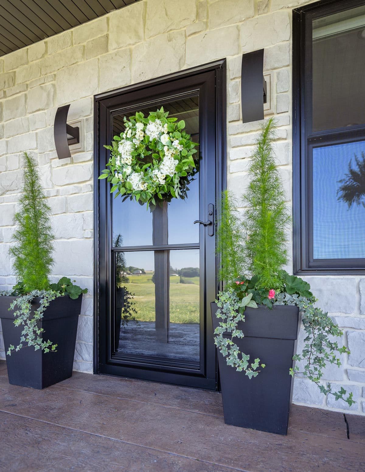 Black storm door outside home